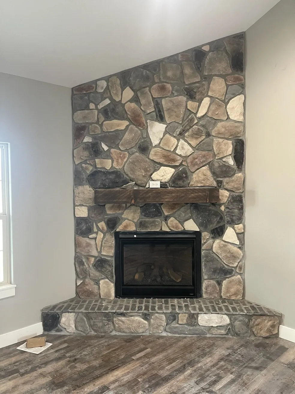 Fieldstone fireplace with Brick feature